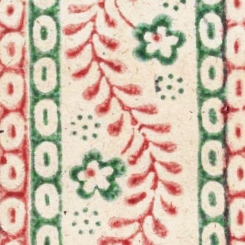 Weißes Modelpapier mit rot-grünem Muster